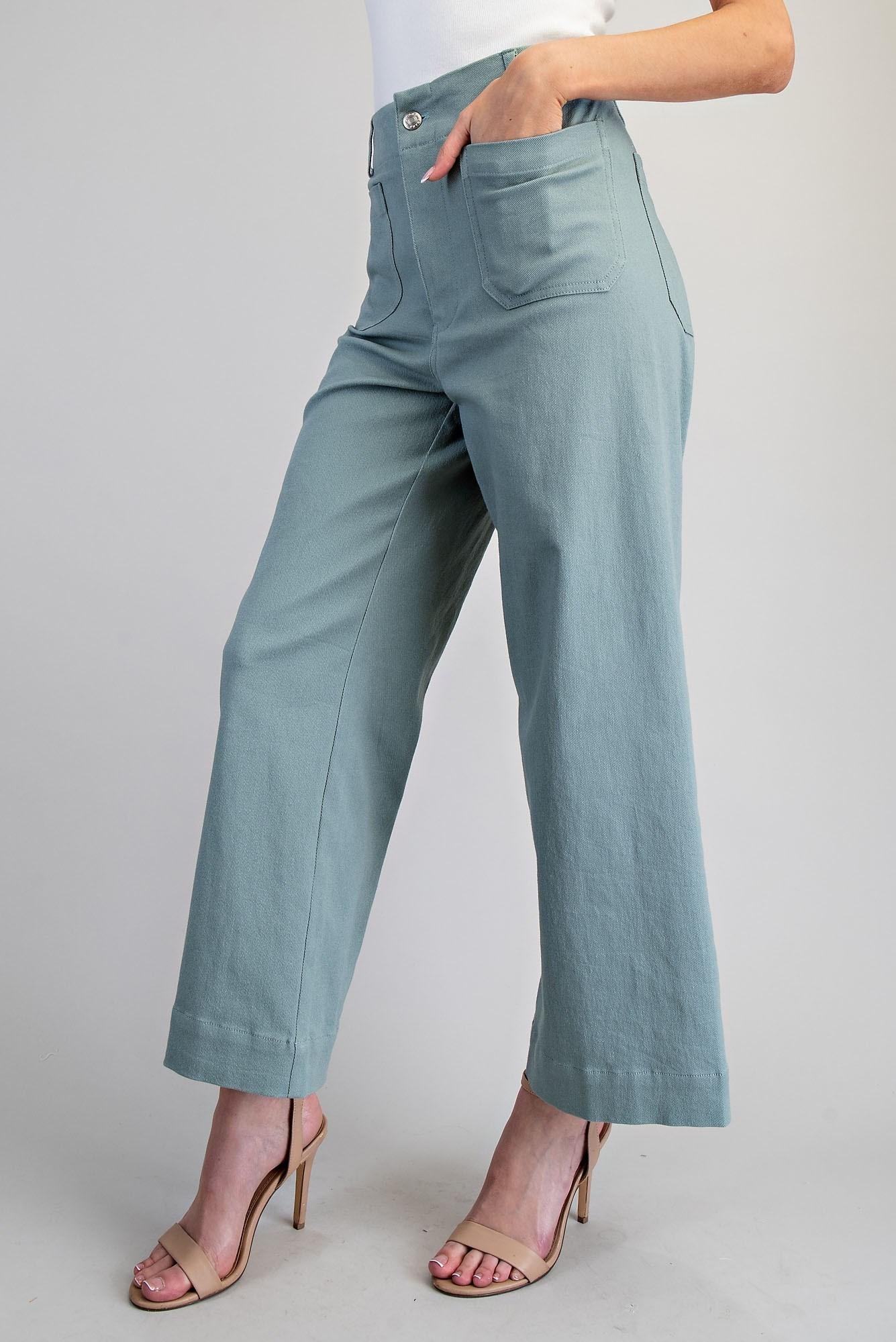 Light blue pants worn by a person on a plain background