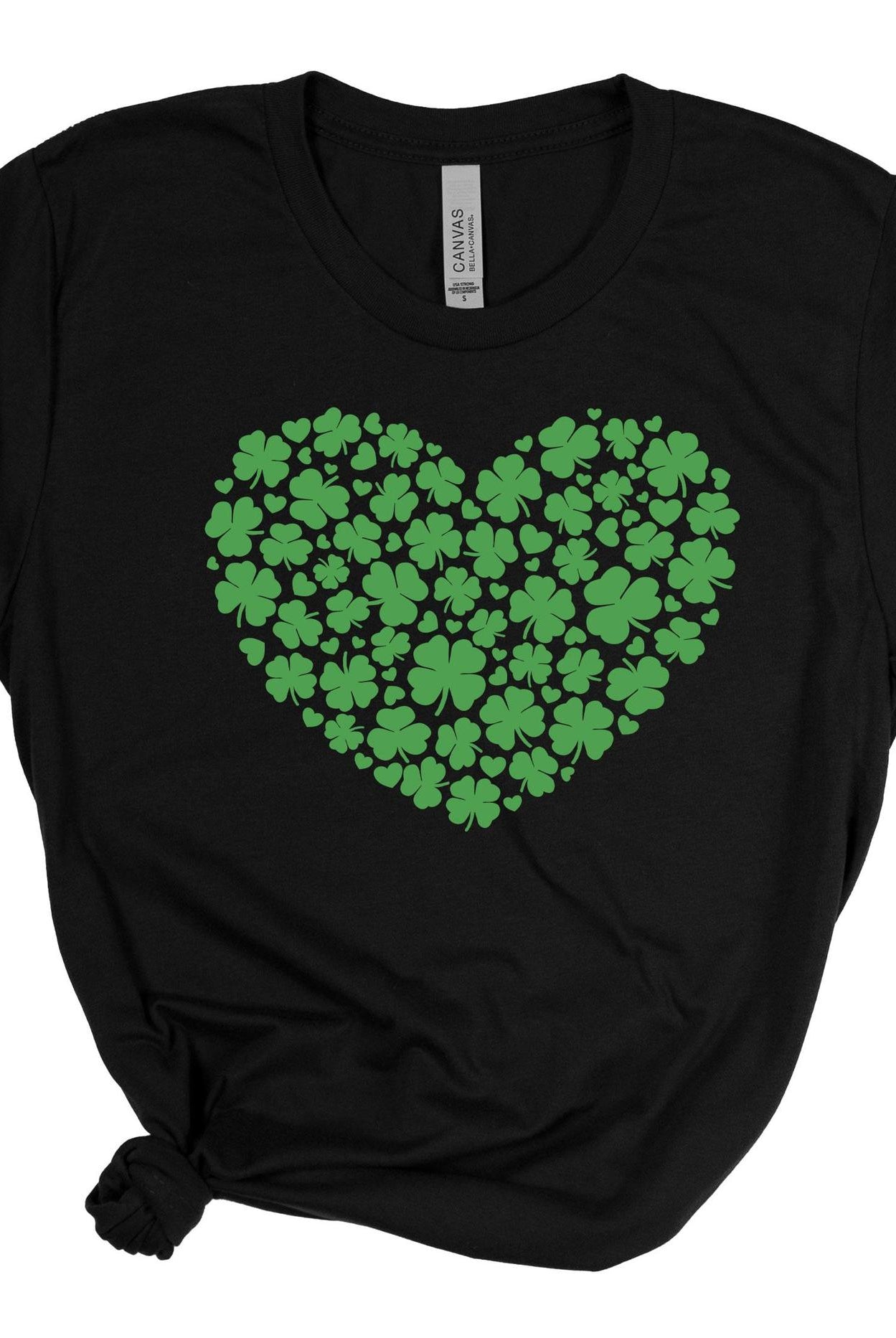 Black t-shirt with a green heart-shaped pattern of shamrocks on a white background
