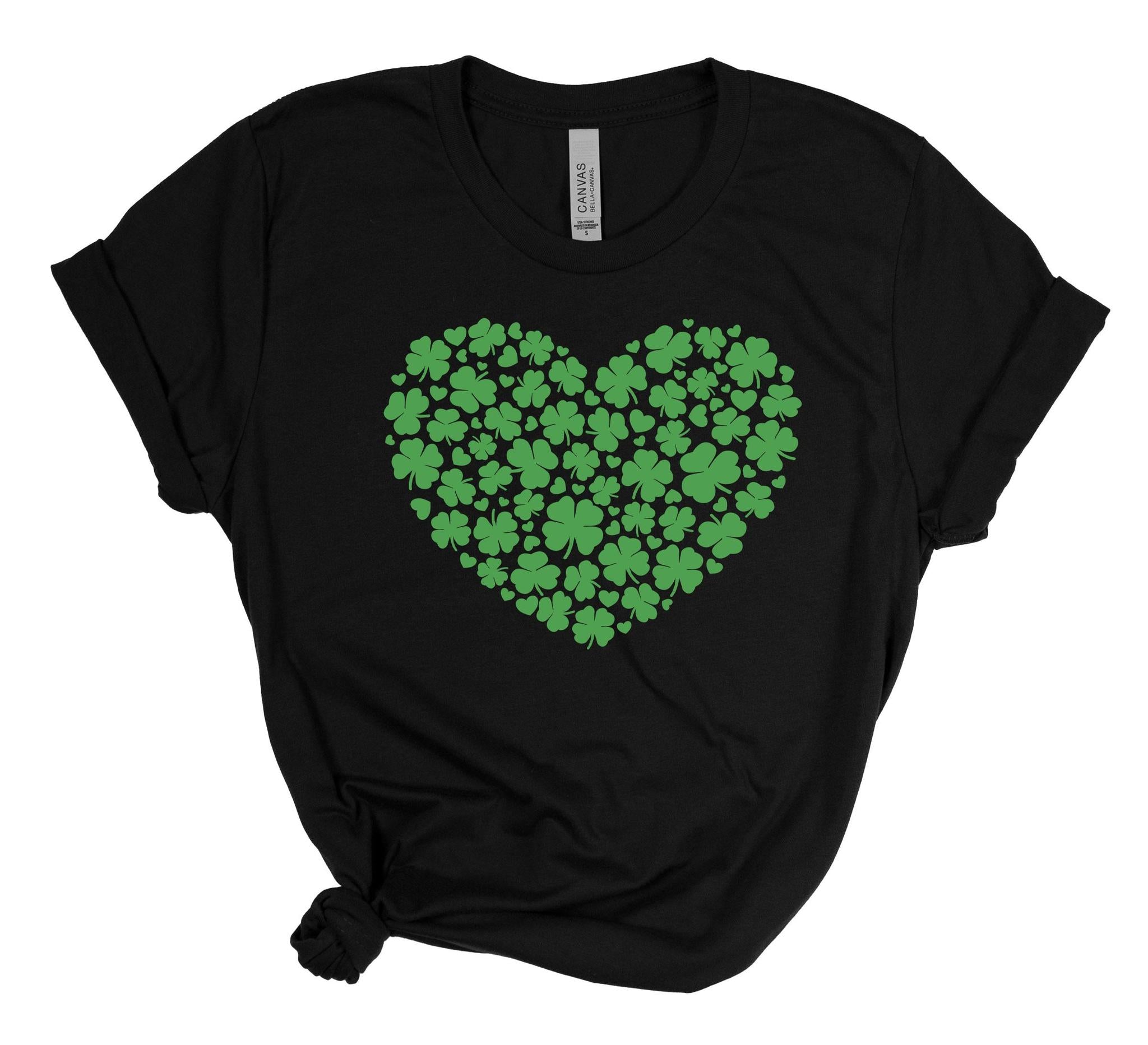 Black t-shirt with a green heart-shaped pattern of shamrocks on a white background