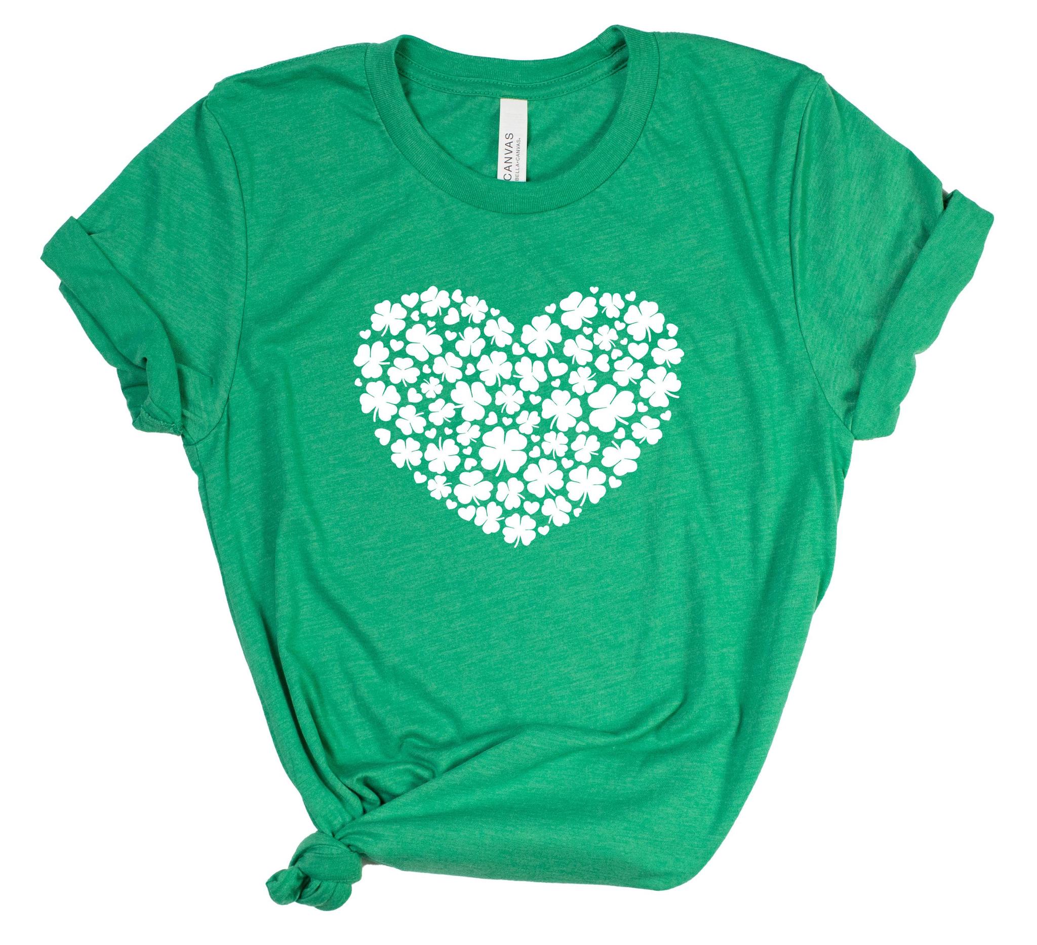 Green t-shirt with a white heart-shaped design of clovers on a white background