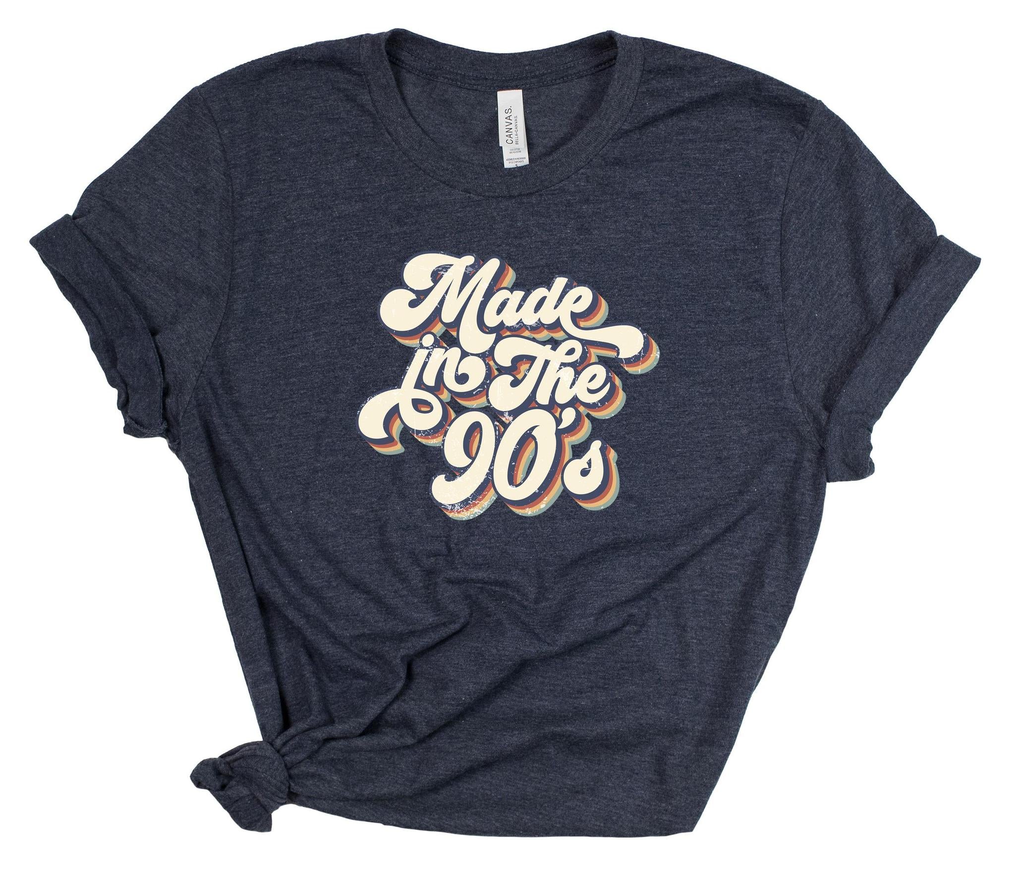 Navy blue t-shirt with 'Made in the 90s' text on a white background