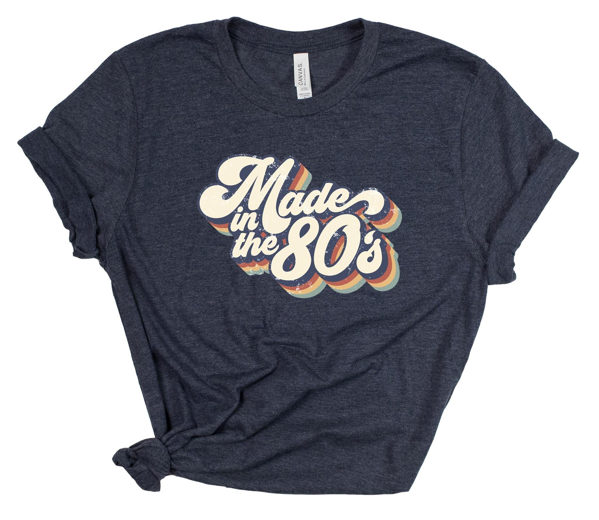 Navy blue t-shirt with 'Made in the 80s' text on a white background