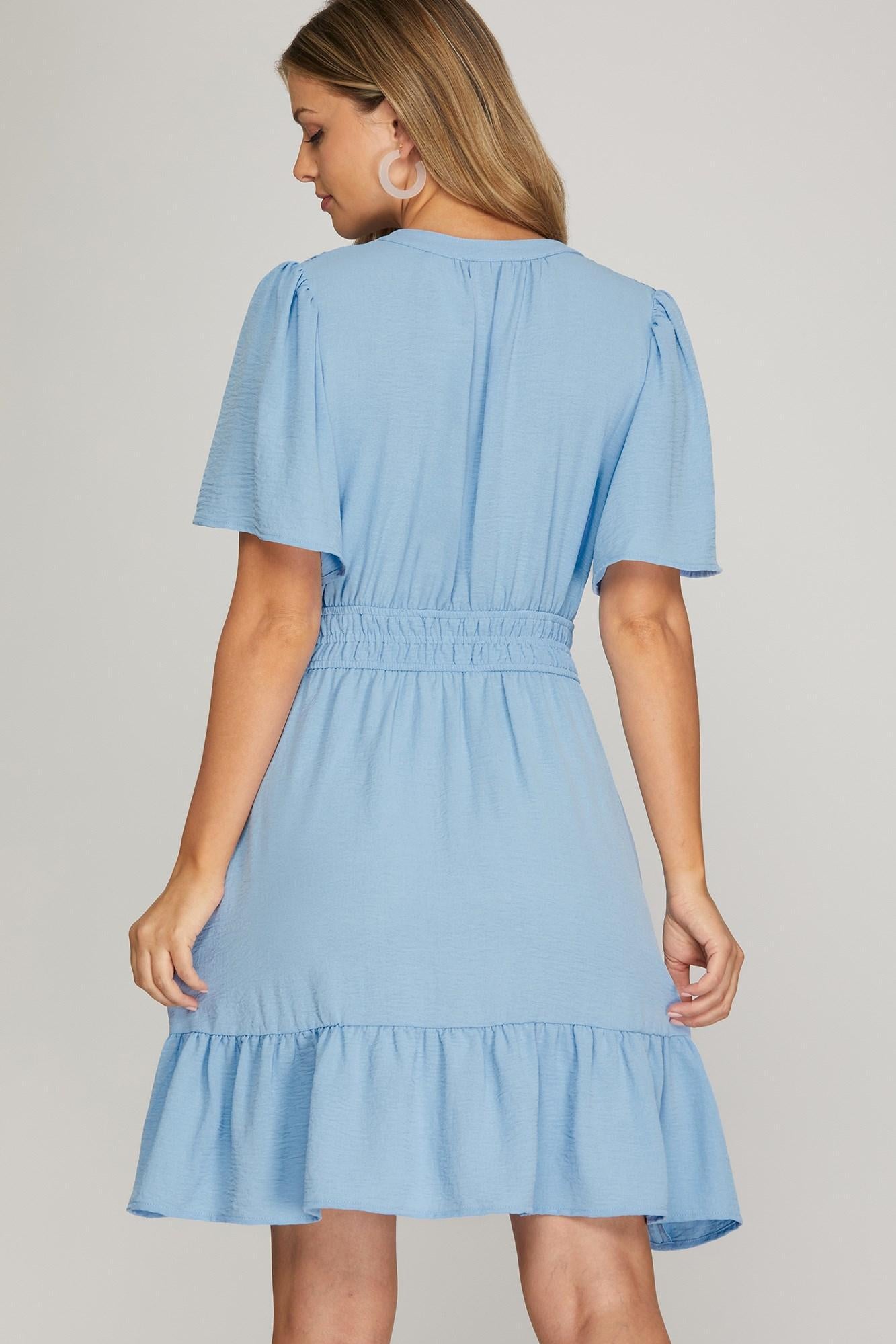 Light blue dress worn by a model on a plain background