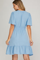Light blue dress worn by a model on a plain background
