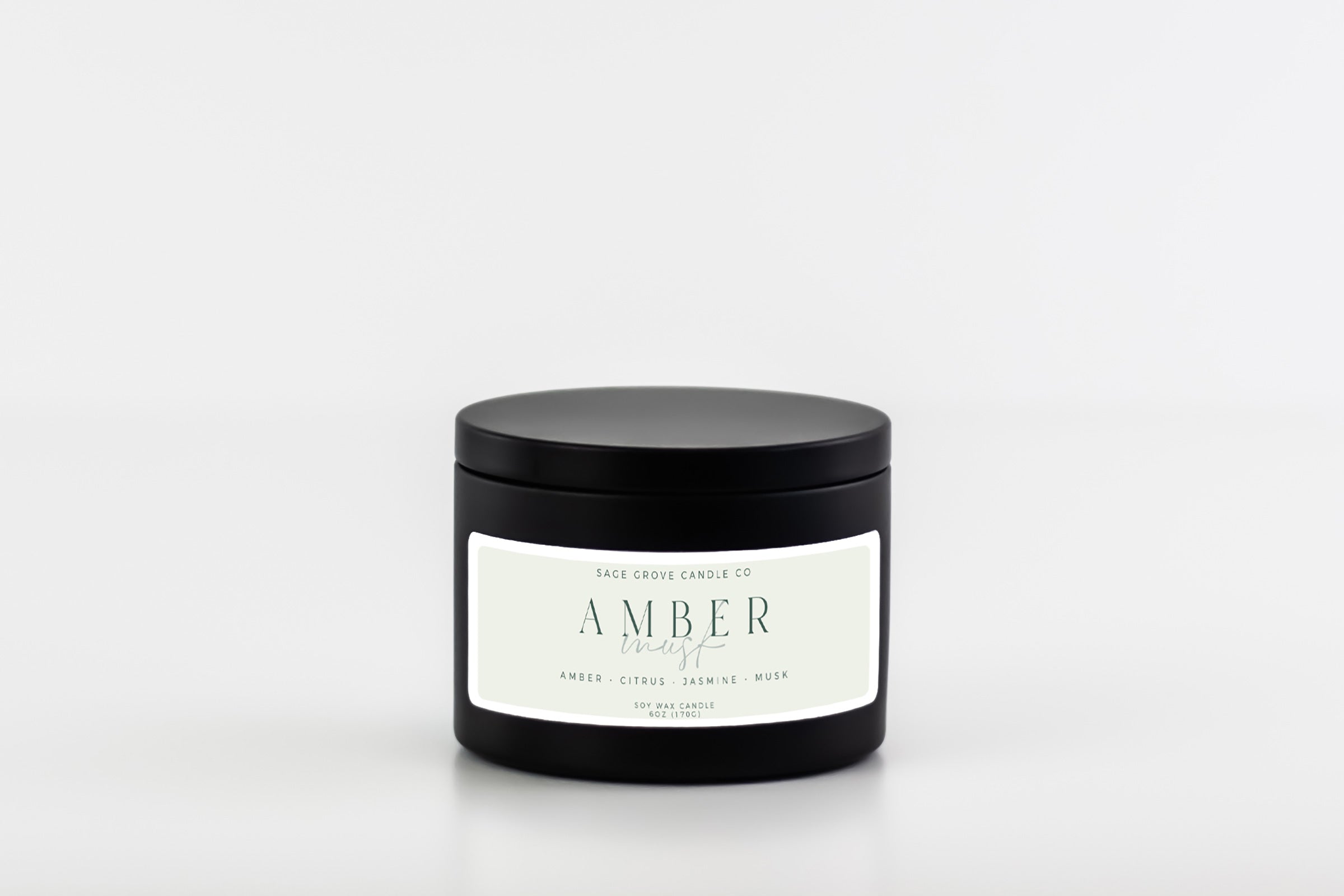 candle in black tin