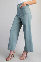 Light blue pants worn by a person on a plain background