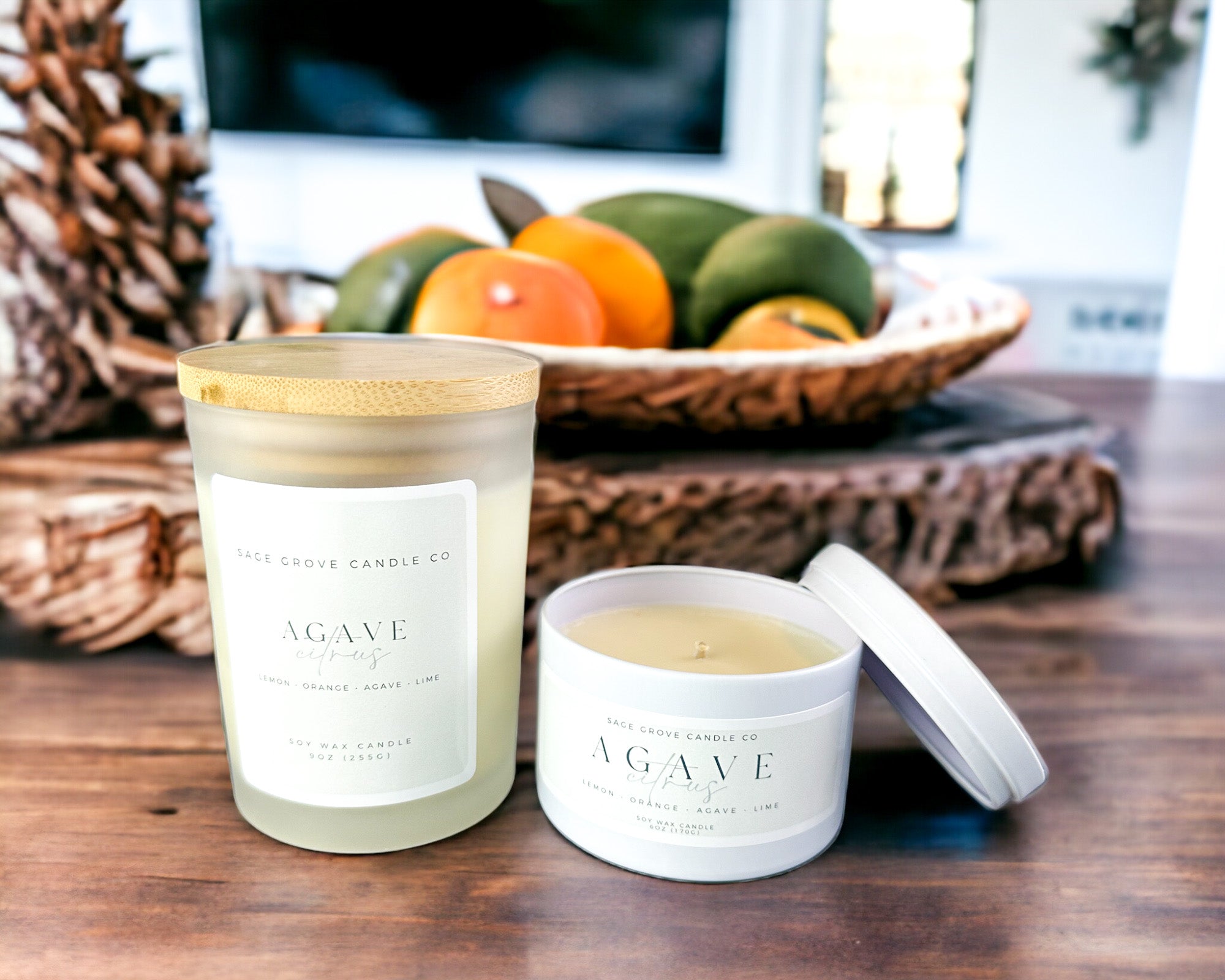 candle on wood table with citrus fruit